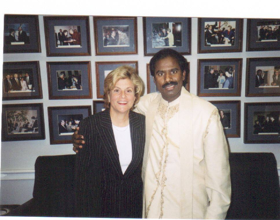 Dr. K.A. Paul portrait with a wall of historic peace meetings
