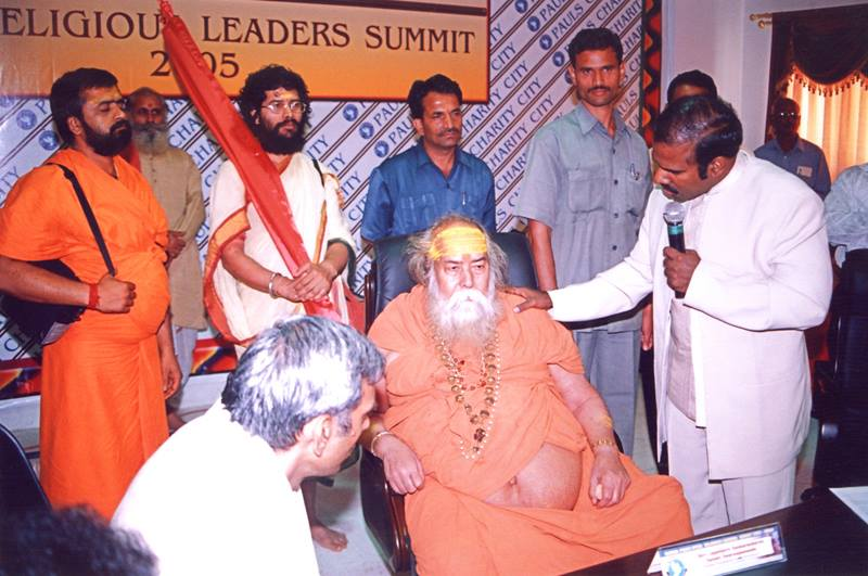 Dr. K.A. Paul speaking with Hindu religious leaders at a summit gathering